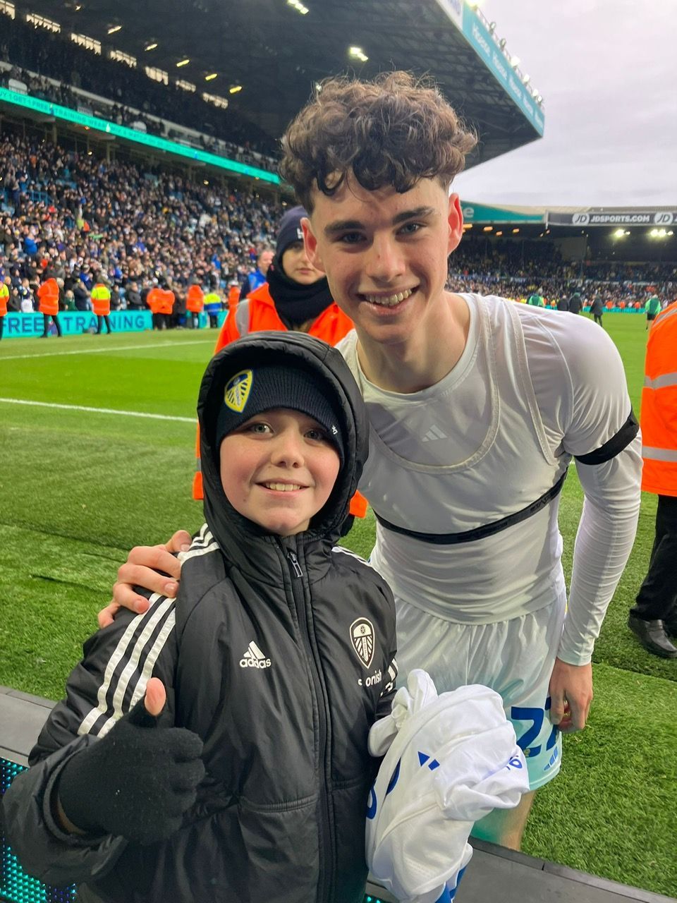 Daniel Butler receiving Archie Gray's shirt