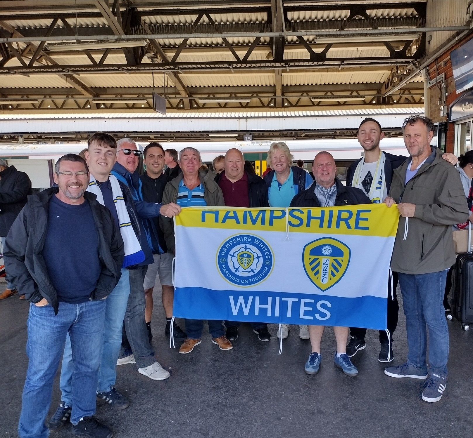 Hampshire Whites group shot with flag on train platform