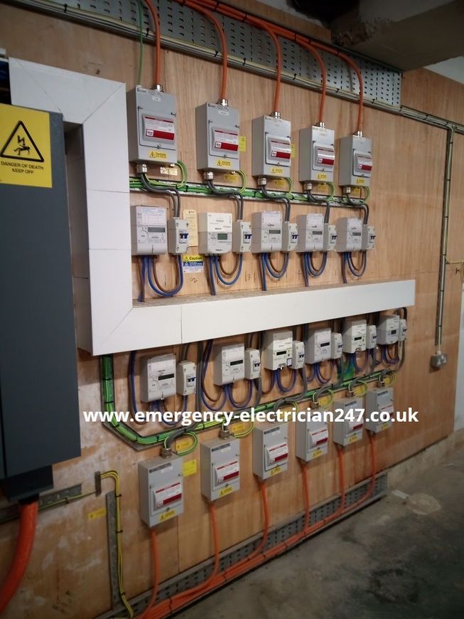 Eleven electricity meters and individual isolators to flats