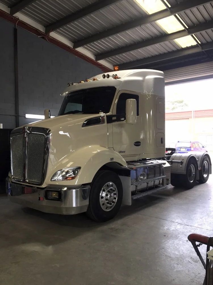 A White Semi Truck is Parked in a Garage — Seabreeze Auto Body in Coffs Harbour, NSW