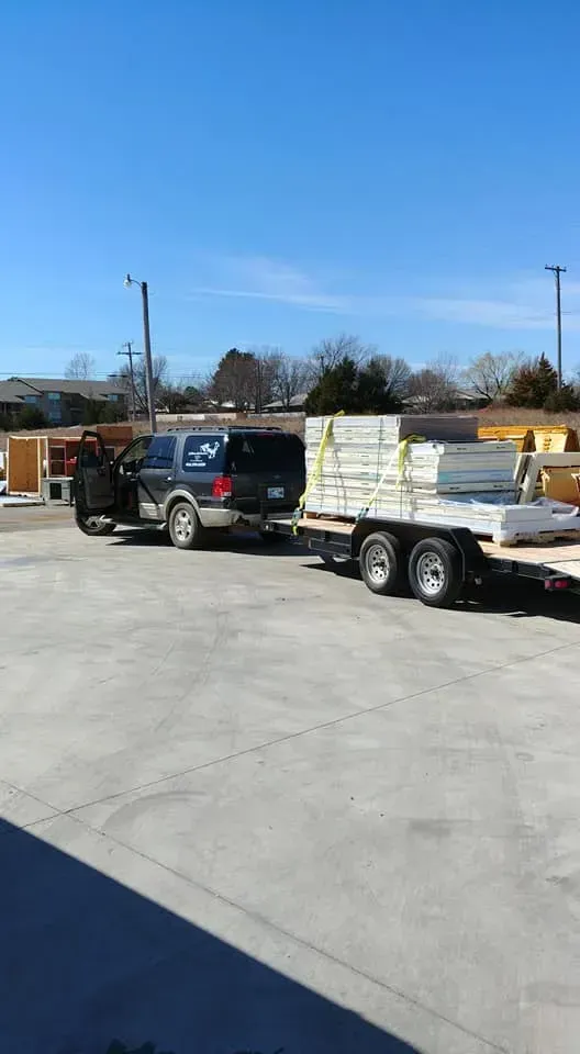 Two trucks are parked next to each other in a parking lot.