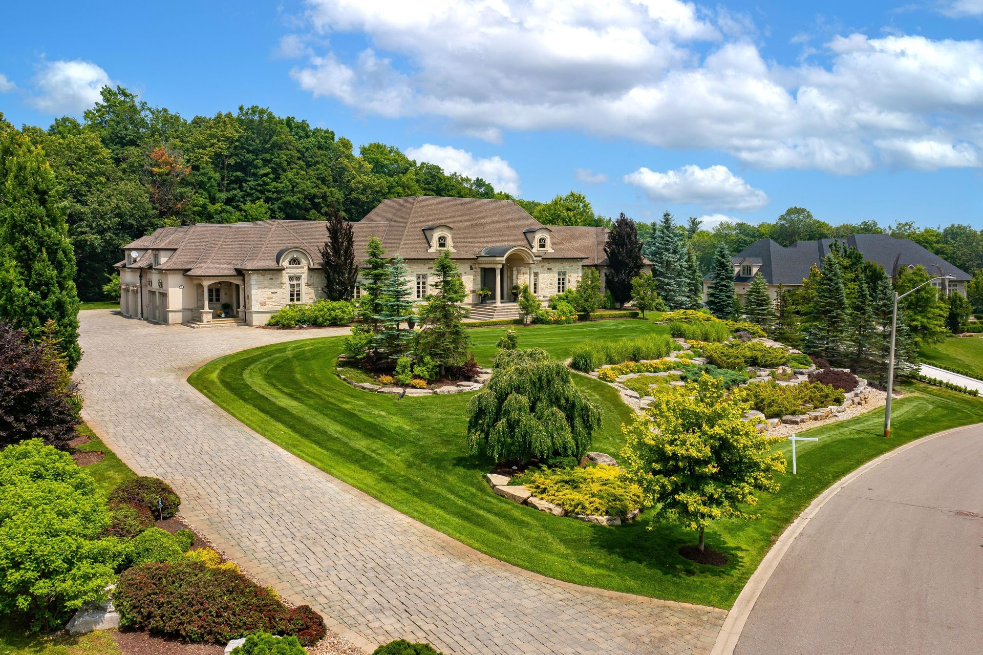 A large house with a driveway leading to it