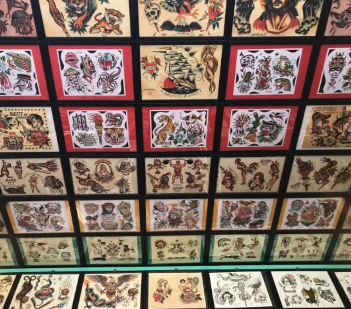 wall of tattoo at Aloha Tattoo