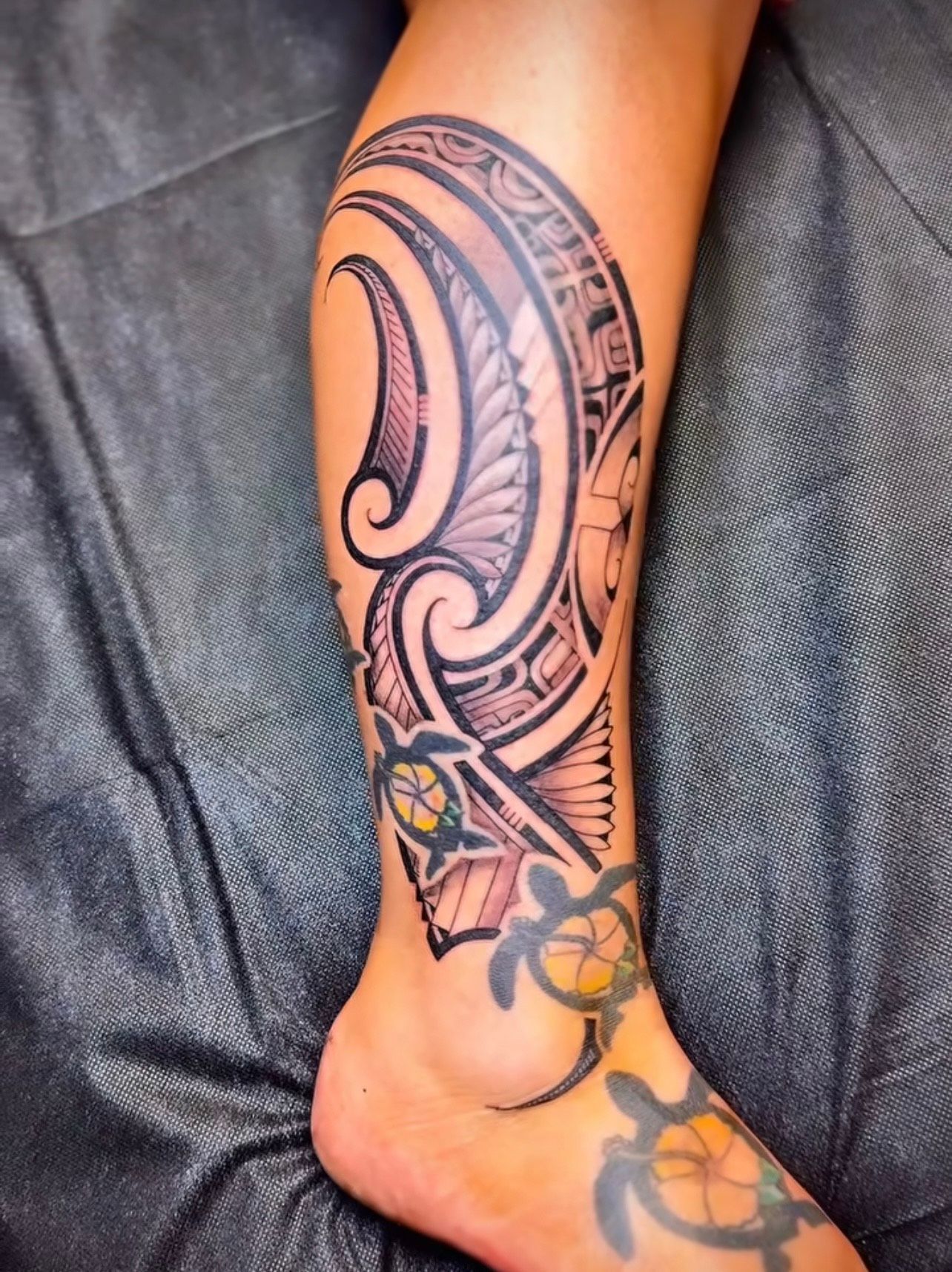 Modern tribal leg tattoo