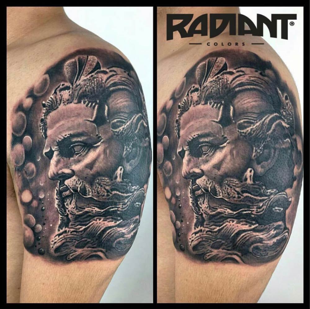 A black and white tattoo of a man with a beard
