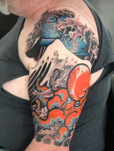 A man has an octopus tattoo on his arm