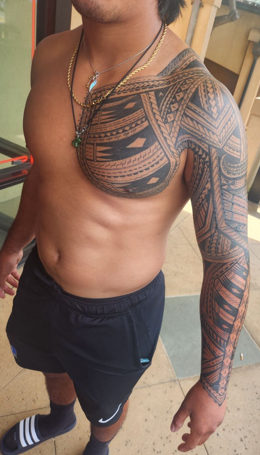 Full sleeve Polynesian tribal tattoo