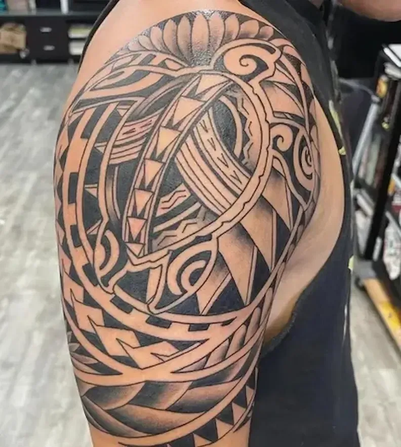 Polynesian tribal tattoo on shoulder created at Aloha Tattoo in Waikiki