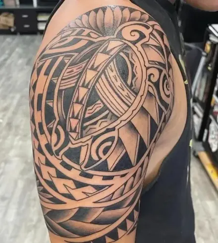 Polynesian tribal tattoo on shoulder created at Aloha Tattoo in Waikiki