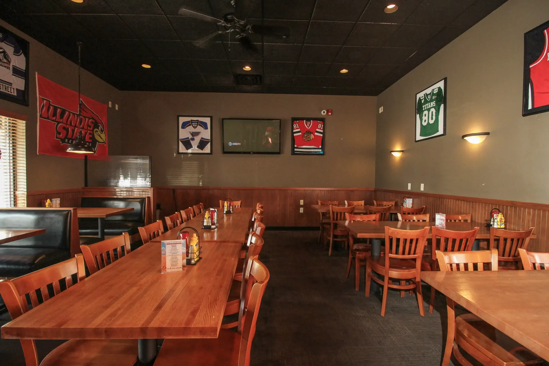 A restaurant with a lot of tables and chairs