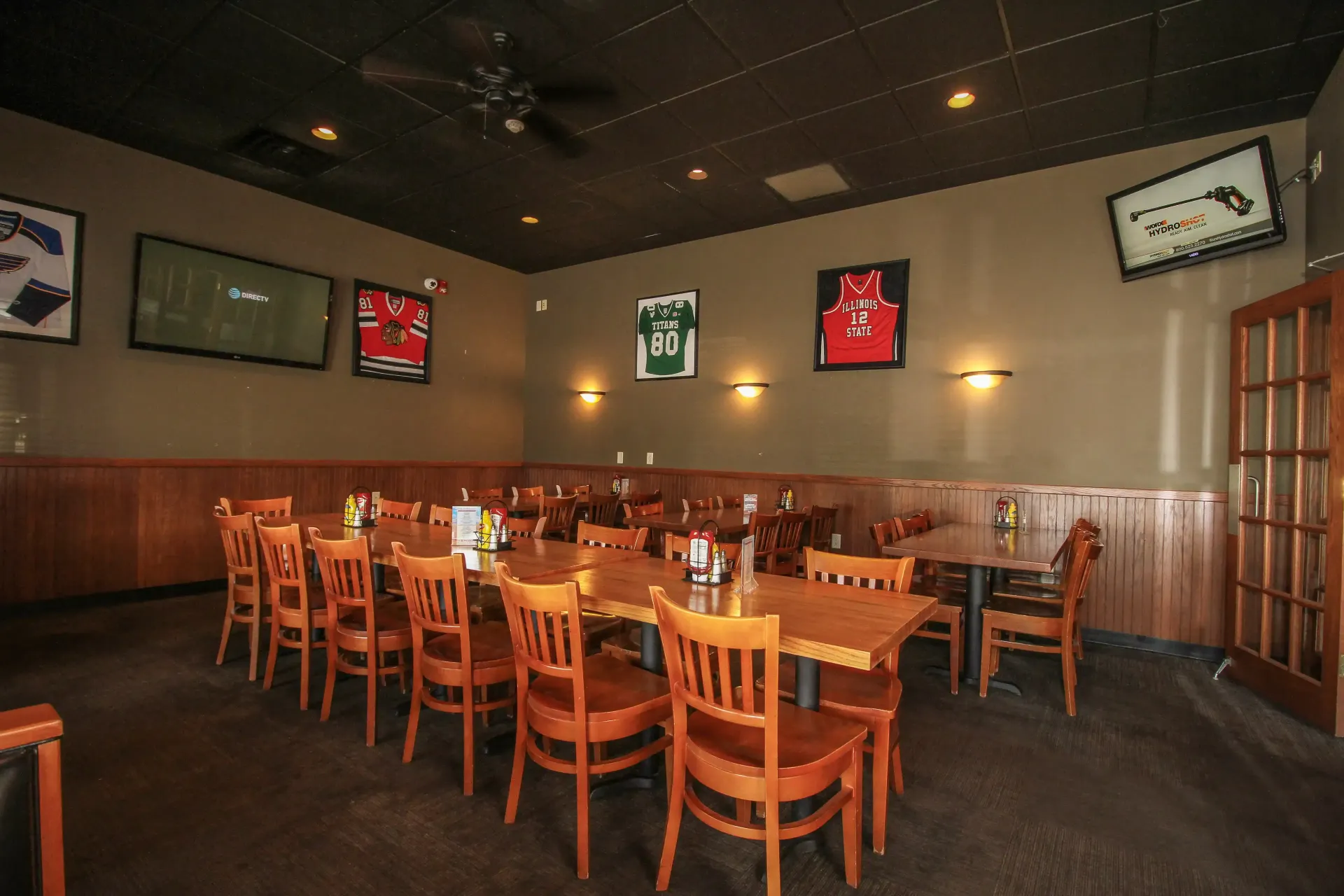 A restaurant with a lot of tables and chairs