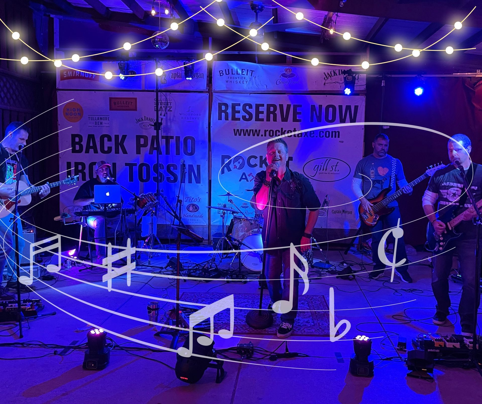 A group of people are playing instruments on a stage in front of a sign.