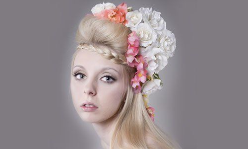 An elaborate bridal hair done with floral accessories