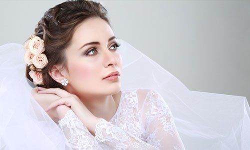 a beautiful bride in white with an elegant bun