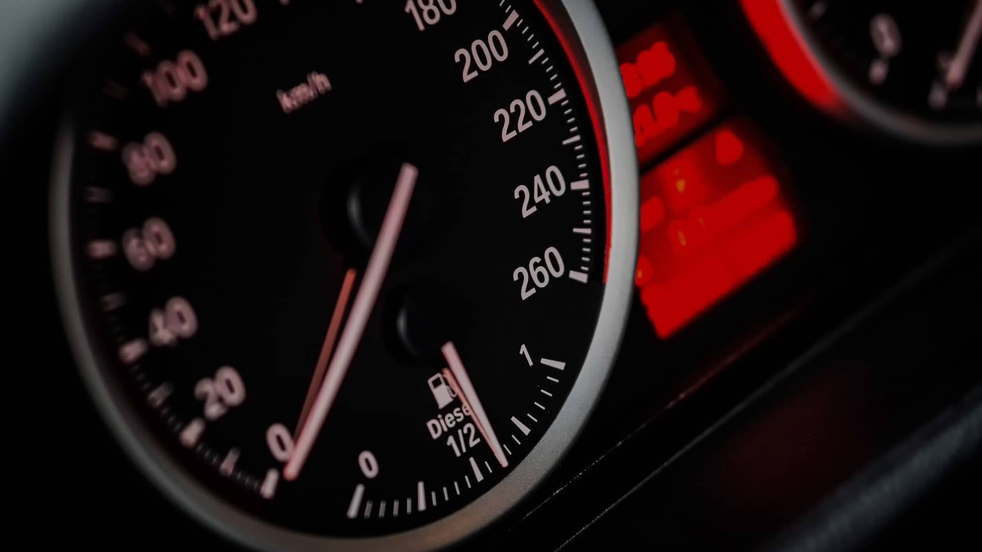 A close up of a car dashboard with a speedometer and a fuel gauge | Doctor of Motors