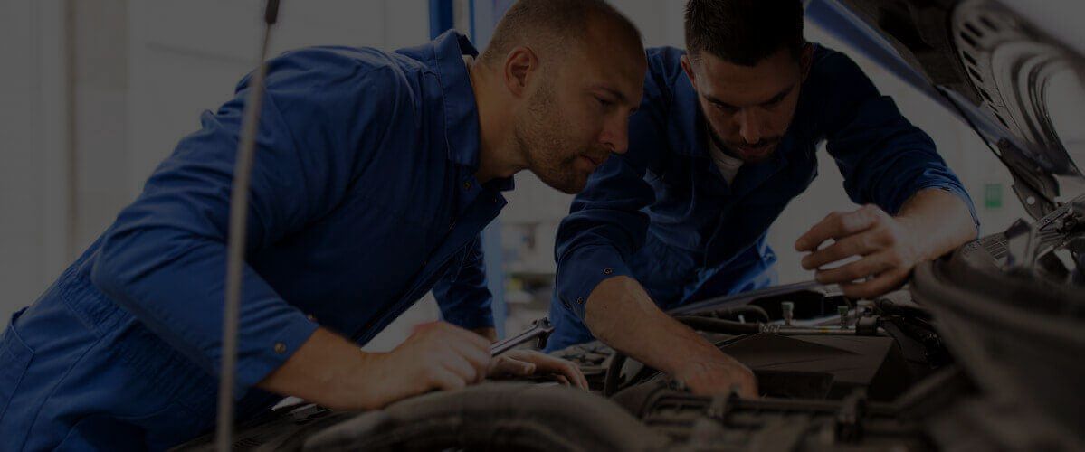 two mechanics working on car | Doctor of Motors