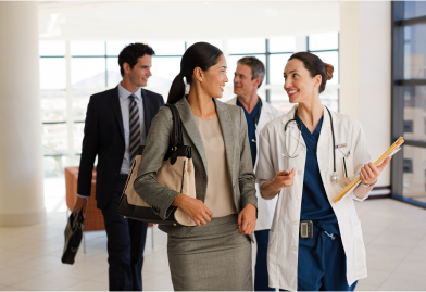A group of people, including a doctor, discuss digital health