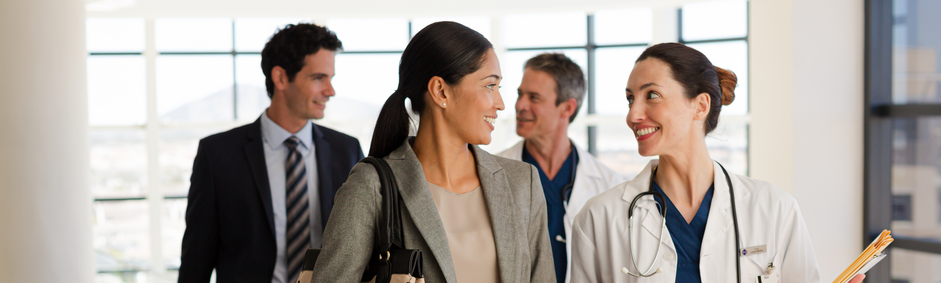 A group of people, including a doctor, discuss digital health