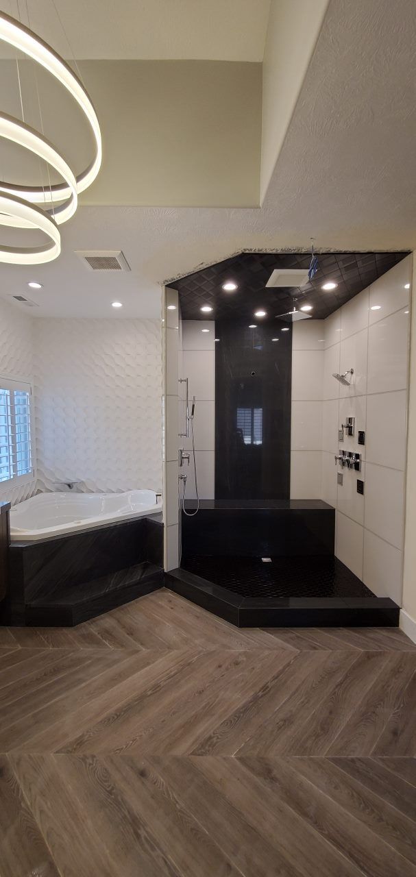 A bathroom with a jacuzzi tub and a shower.