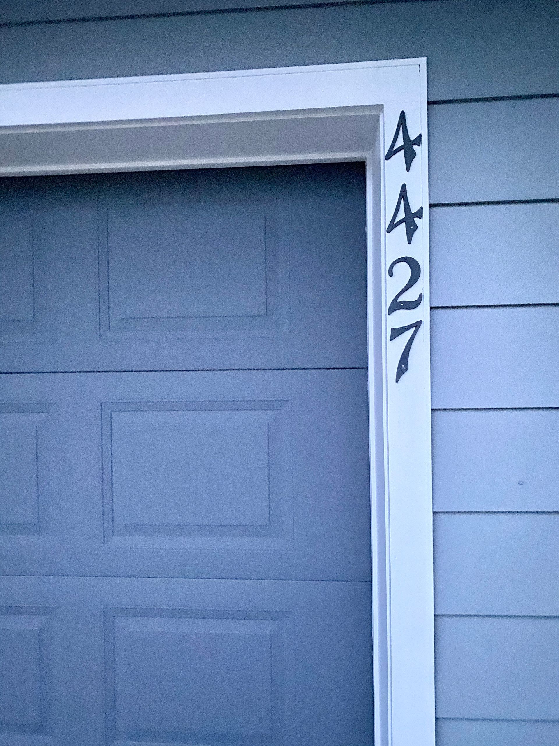 A garage door with the number 4:27 painted on it