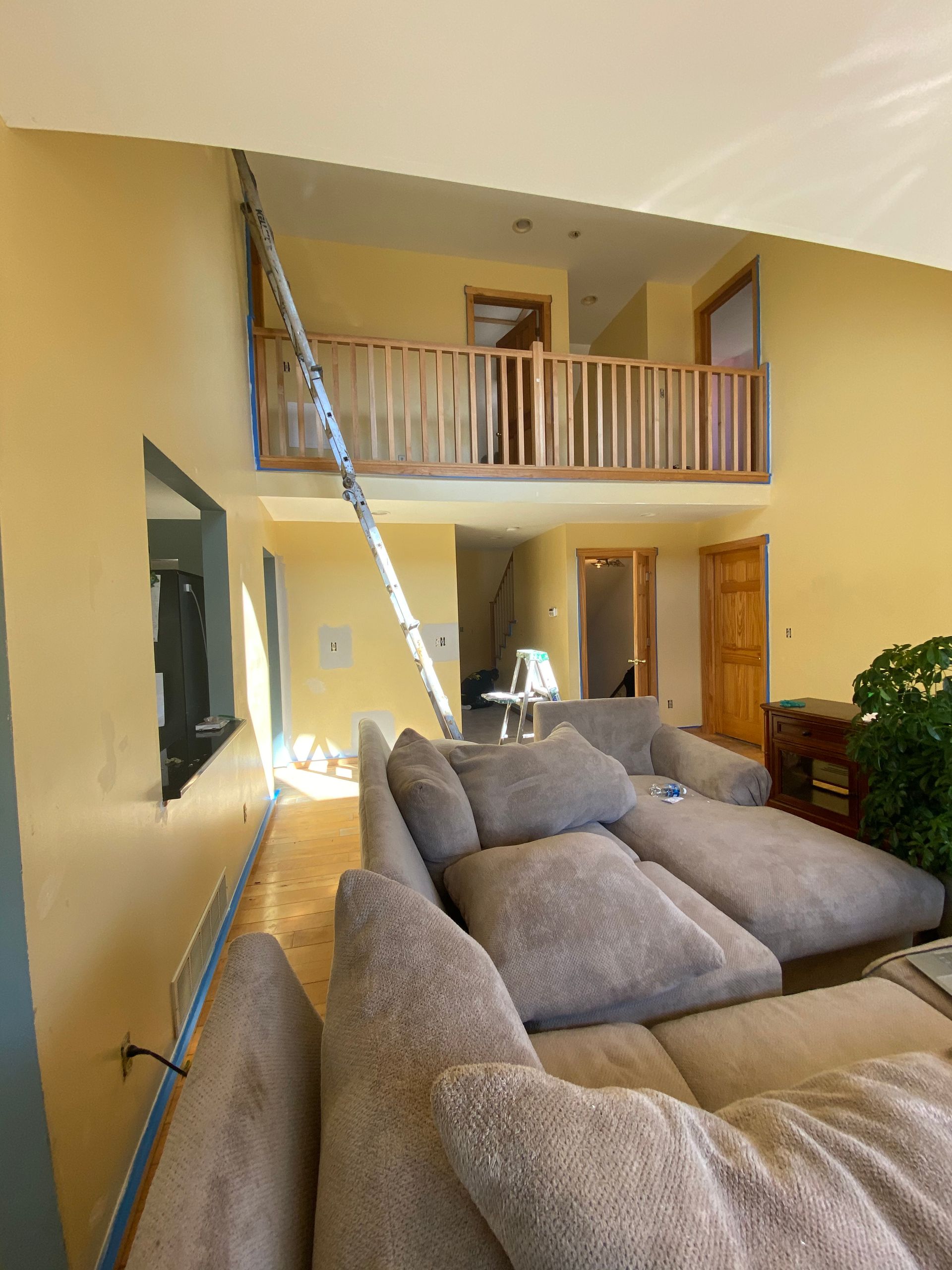 A living room with a couch and a balcony