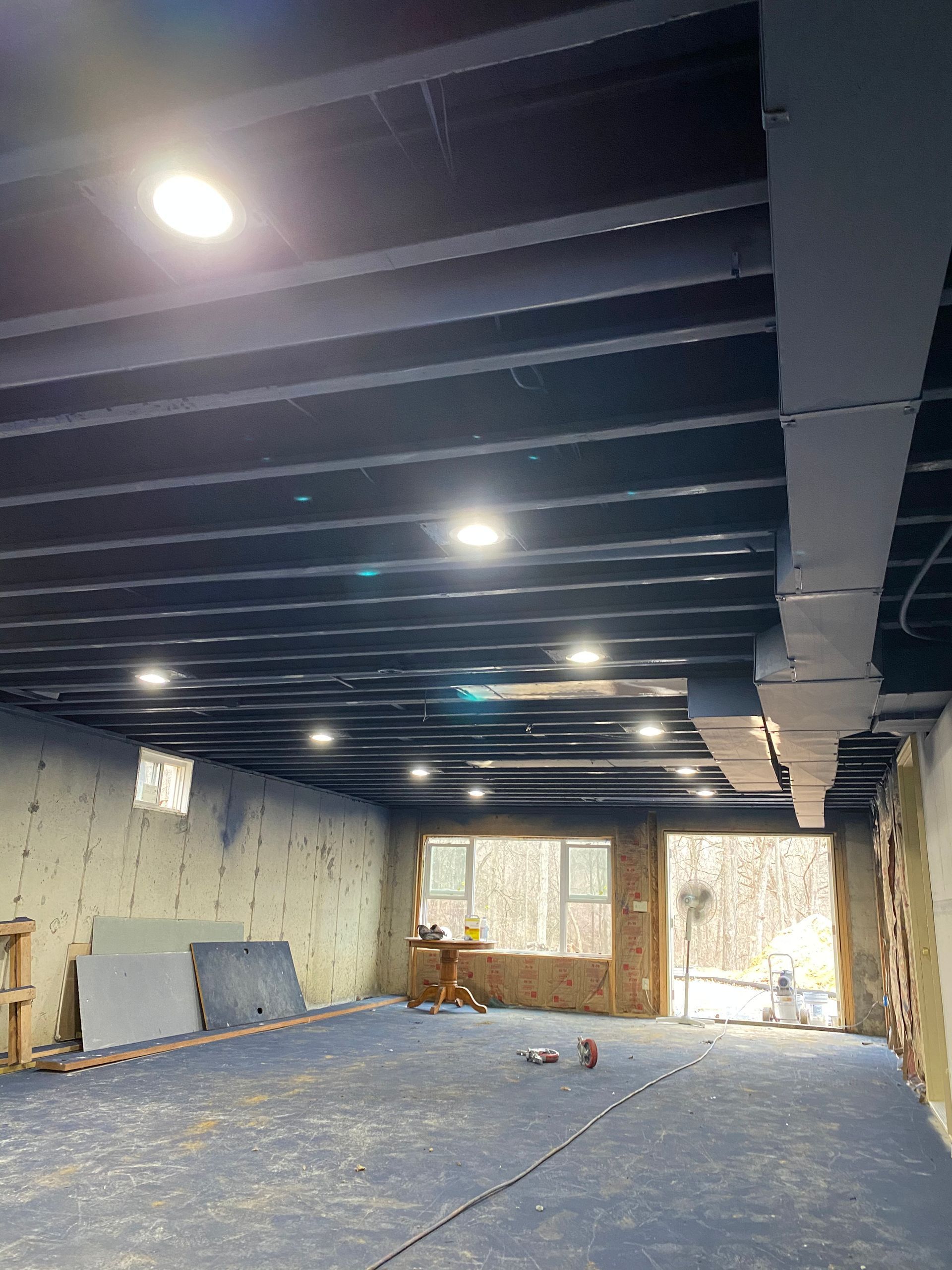 A large room with a ceiling that is being built.