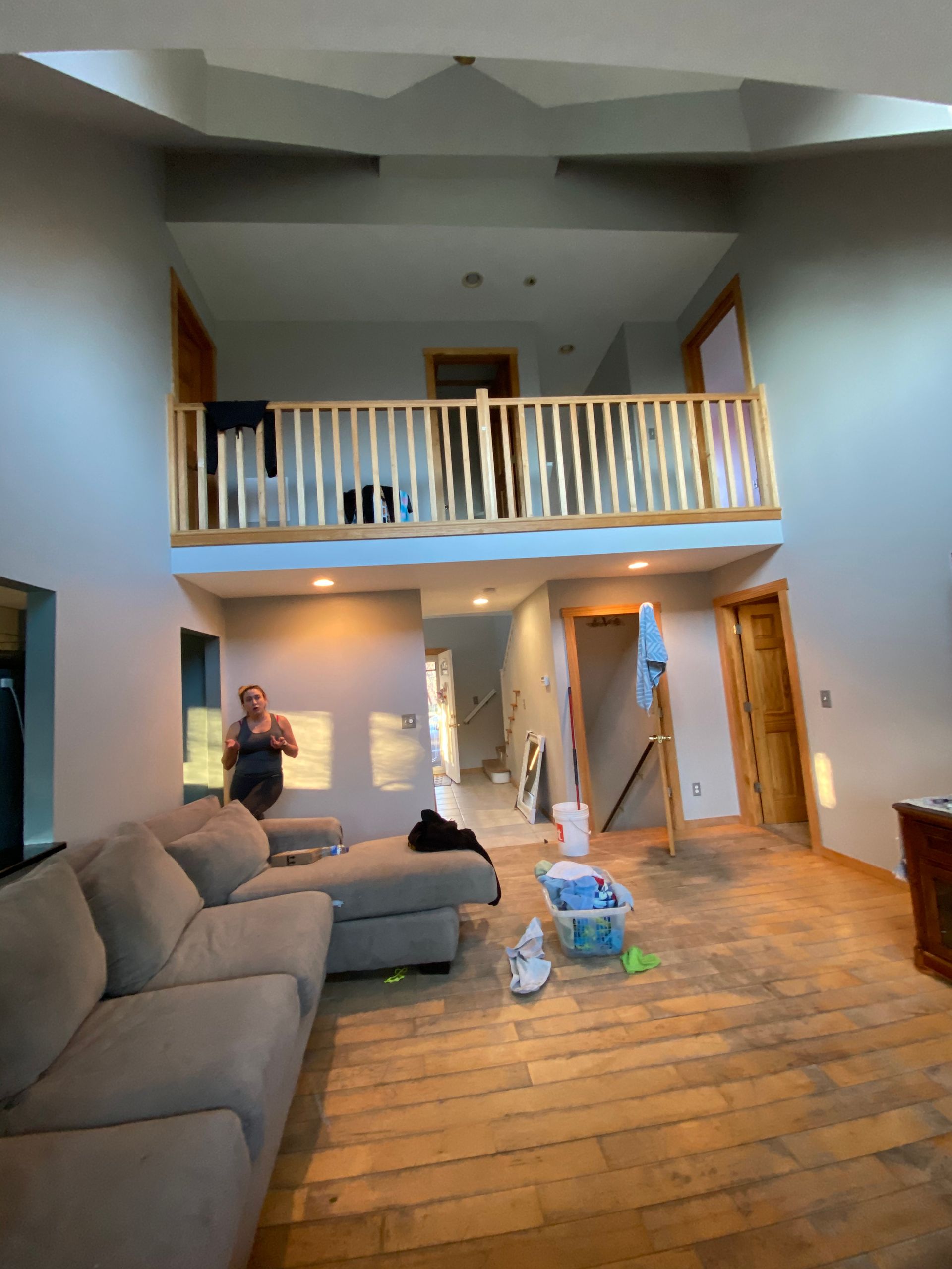 A living room with a couch and a balcony