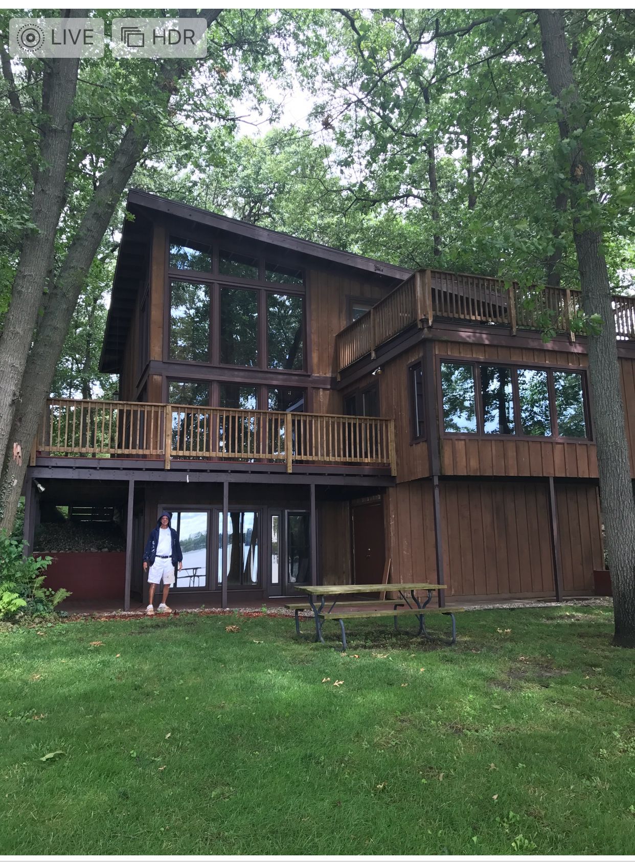 A large house with a picnic table in front of it
