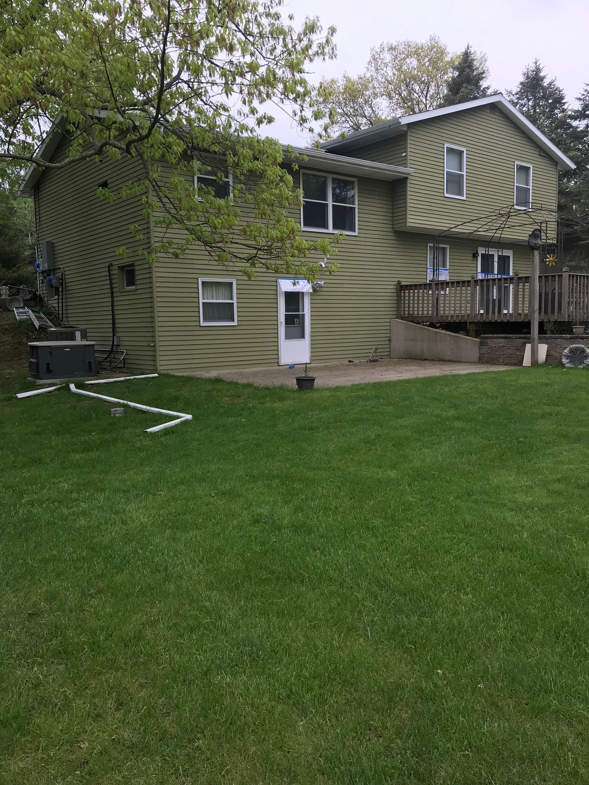 A large house with a large lawn in front of it