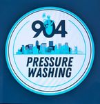 Logo for 904 Pressure Washing: Blue and white circle with city skyline and text. Includes a person pressure washing.