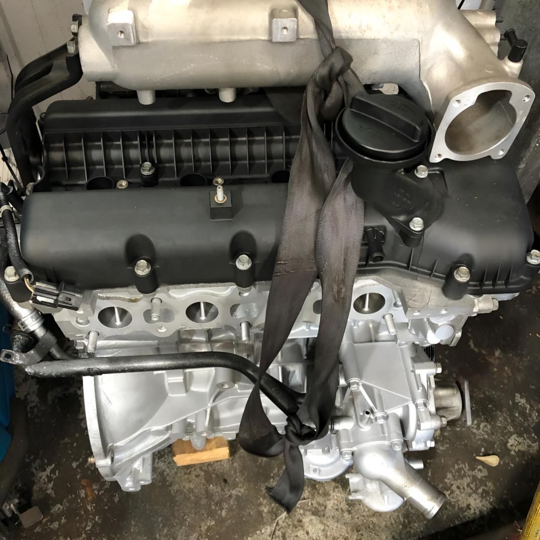 A Close Up of a Car Engine with a Strap Around It — Coolangatta Automotive in Coolangatta, QLD