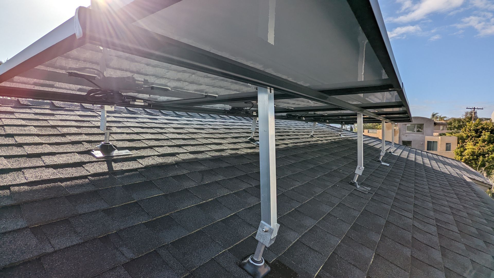 A solar panel is sitting on top of a roof.