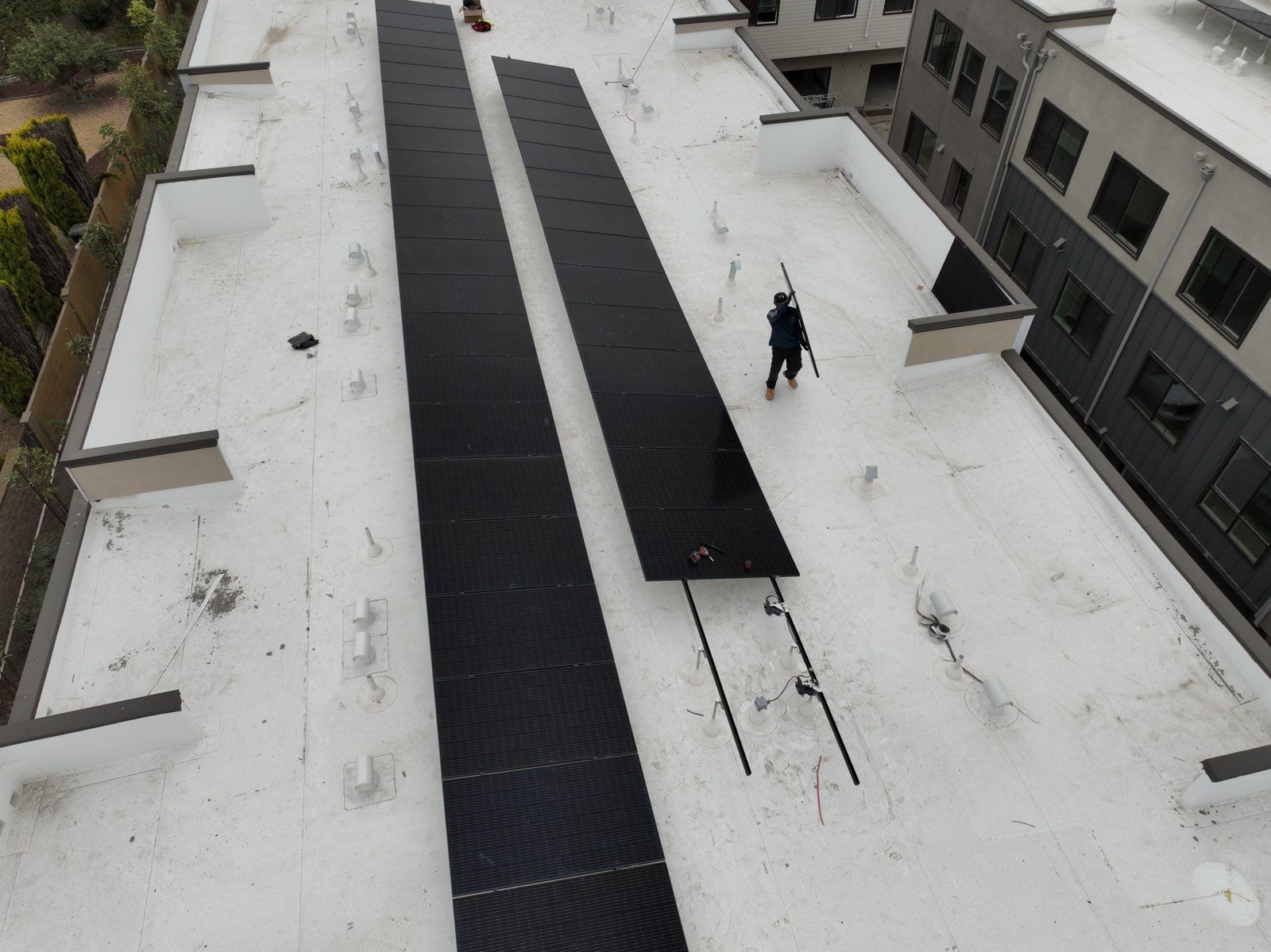 An aerial view of a roof with solar panels on it