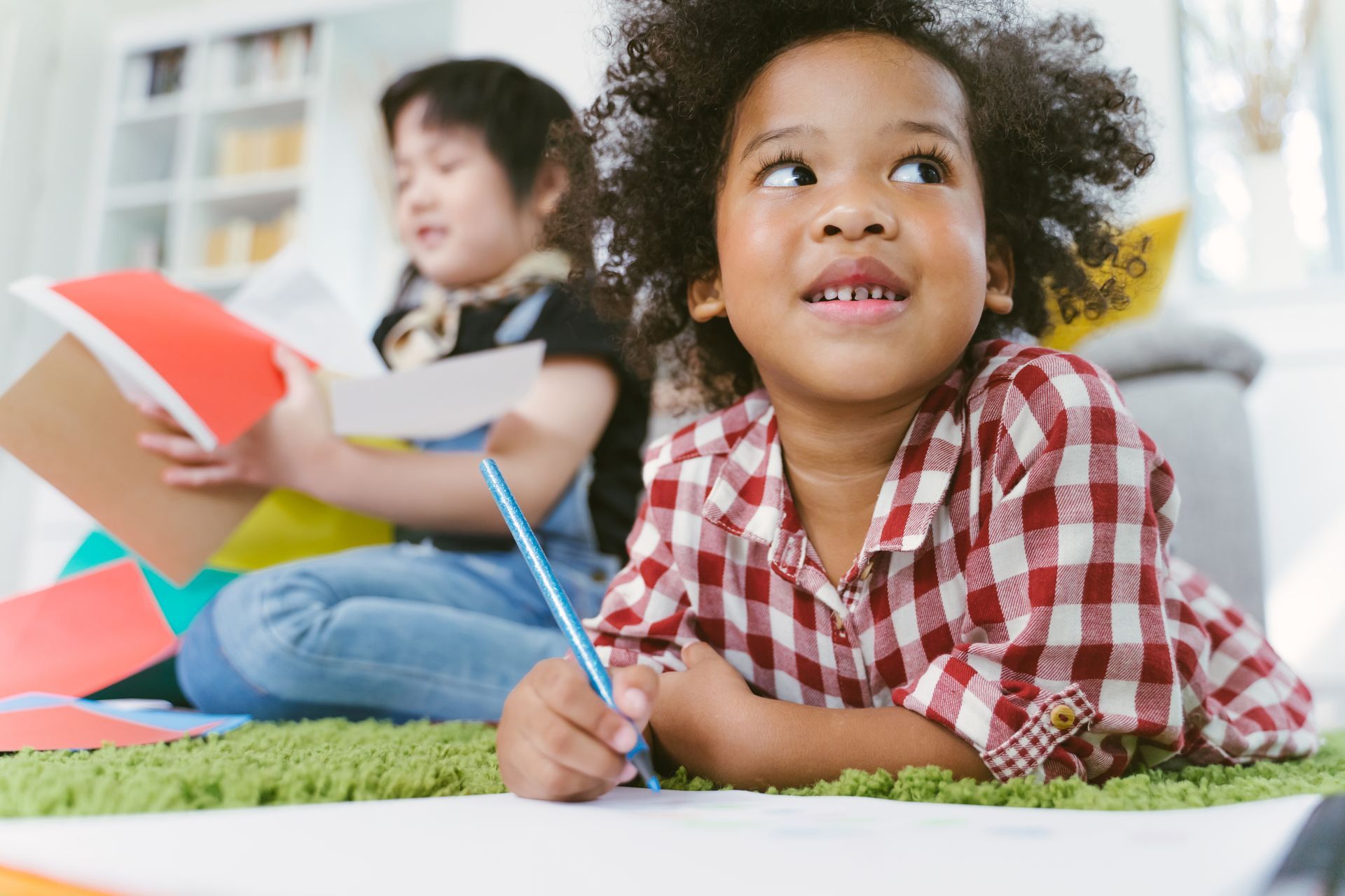 A room with a bulletin board that has a light bulb on it