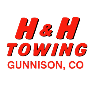 Red and black H & H Towing logo with 
