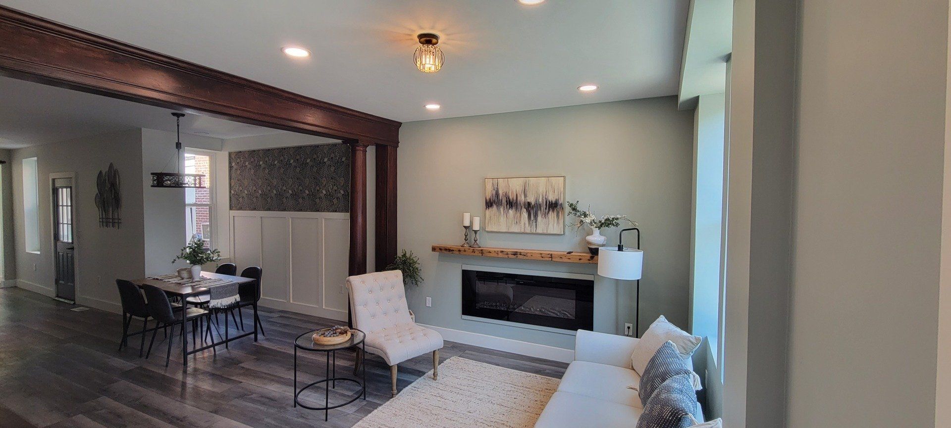 a living room filled with furniture and a fireplace .