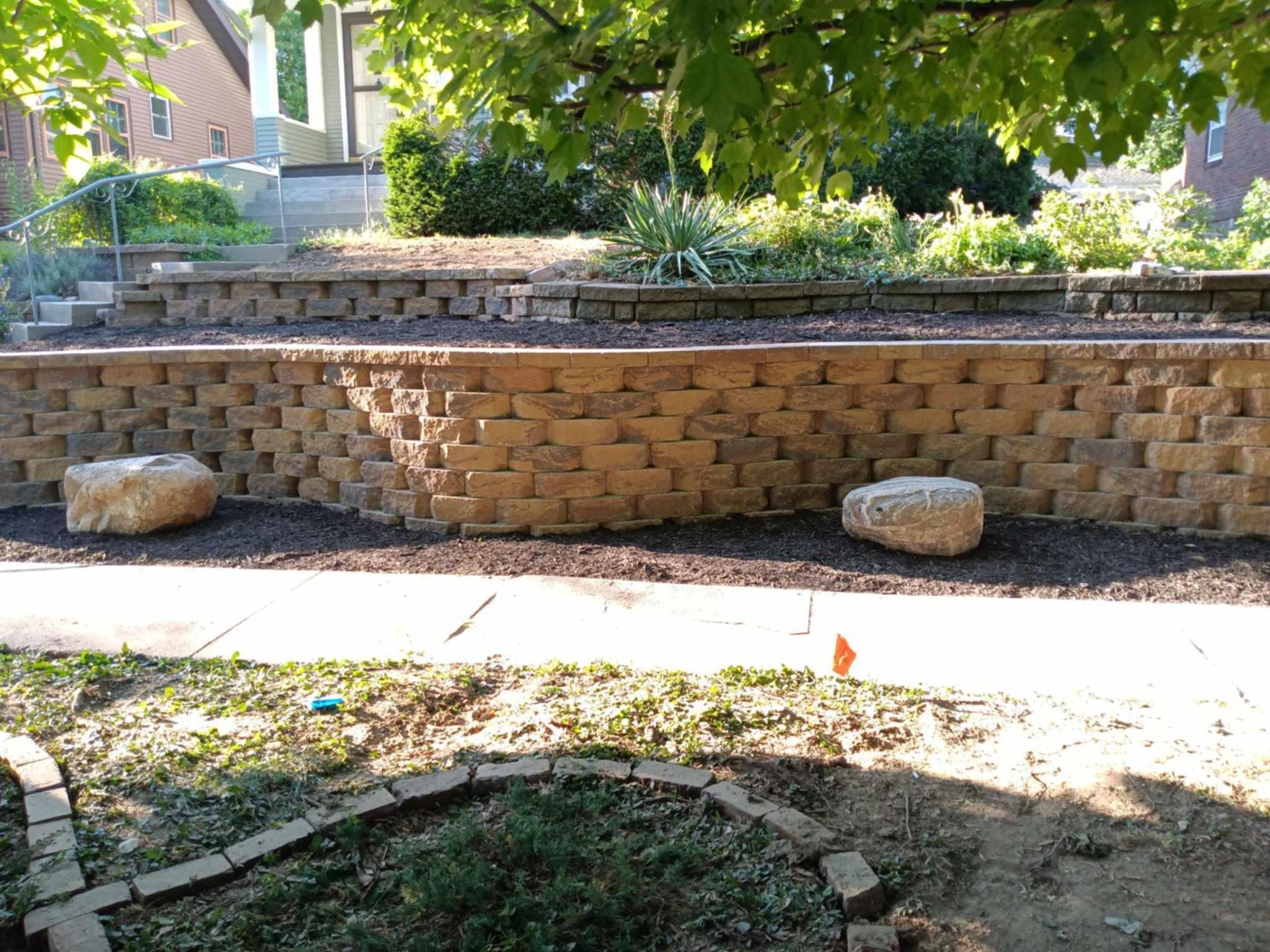A wooden deck with a couch and chairs on it