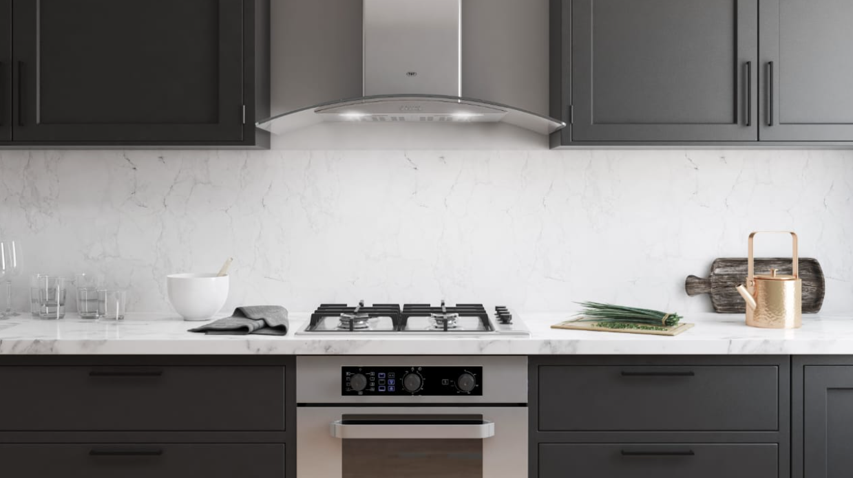 Una cocina con gabinetes negros y un horno de estufa.