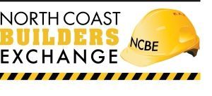 A yellow hard hat with the words north coast builders exchange on it