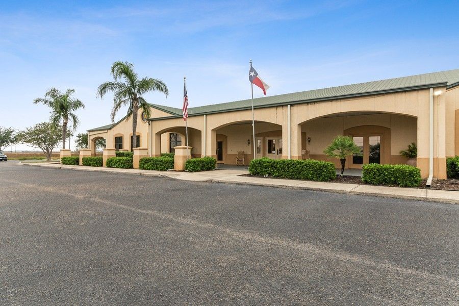 A large building with a texas flag in front of it