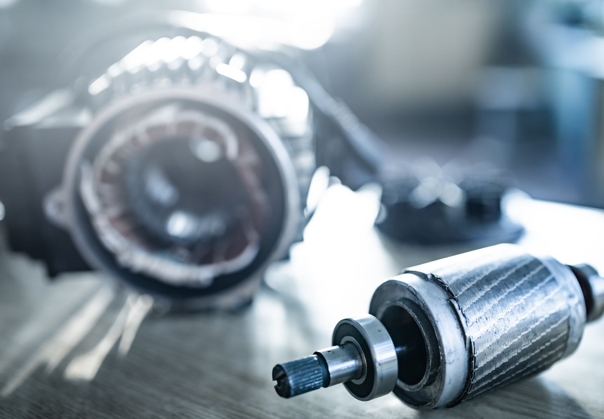 Close-up of iron industrial motor lies on a table.