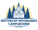 Cabin in forest, Buttercup Woodlands Campground logo. Blue trees, beige sun, text.
