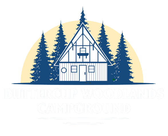 Cabin logo with a house, trees, and sun in blue and white.