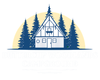 Cabin logo with a house, trees, and sun in blue and white.