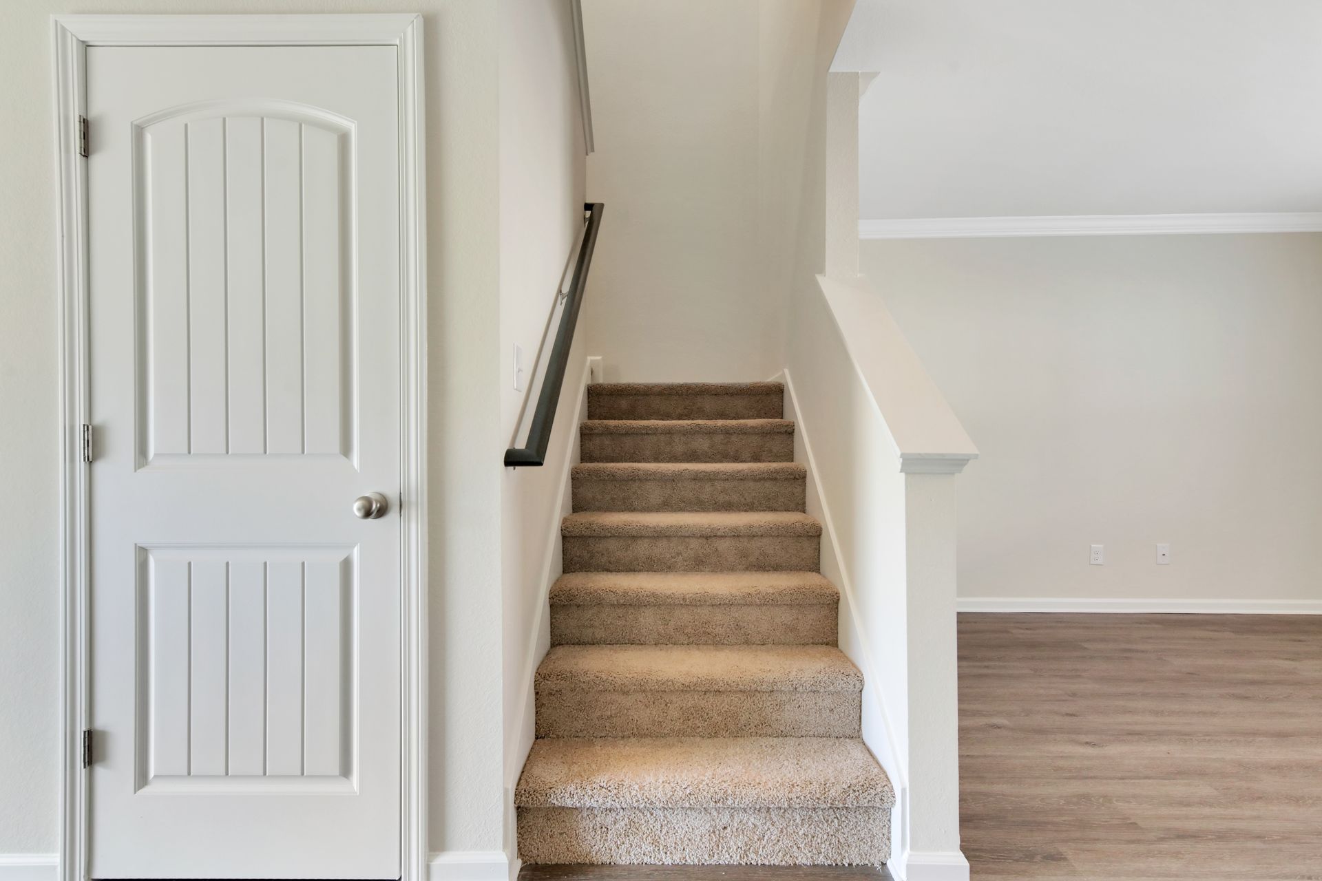 A set of stairs leading up to the second floor of a house.