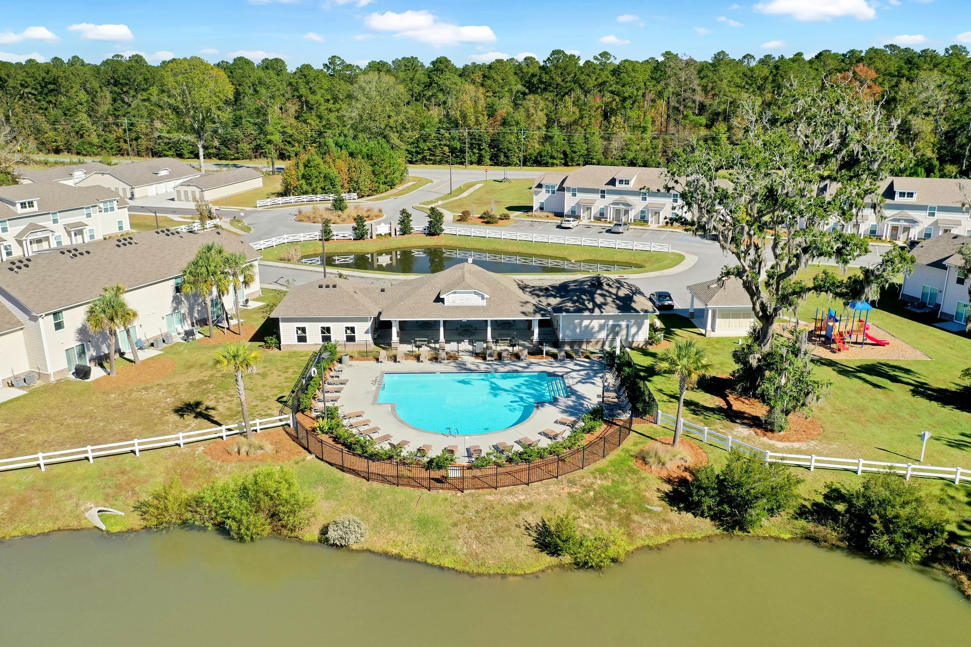 An aerial view of a swimming pool in a residential area