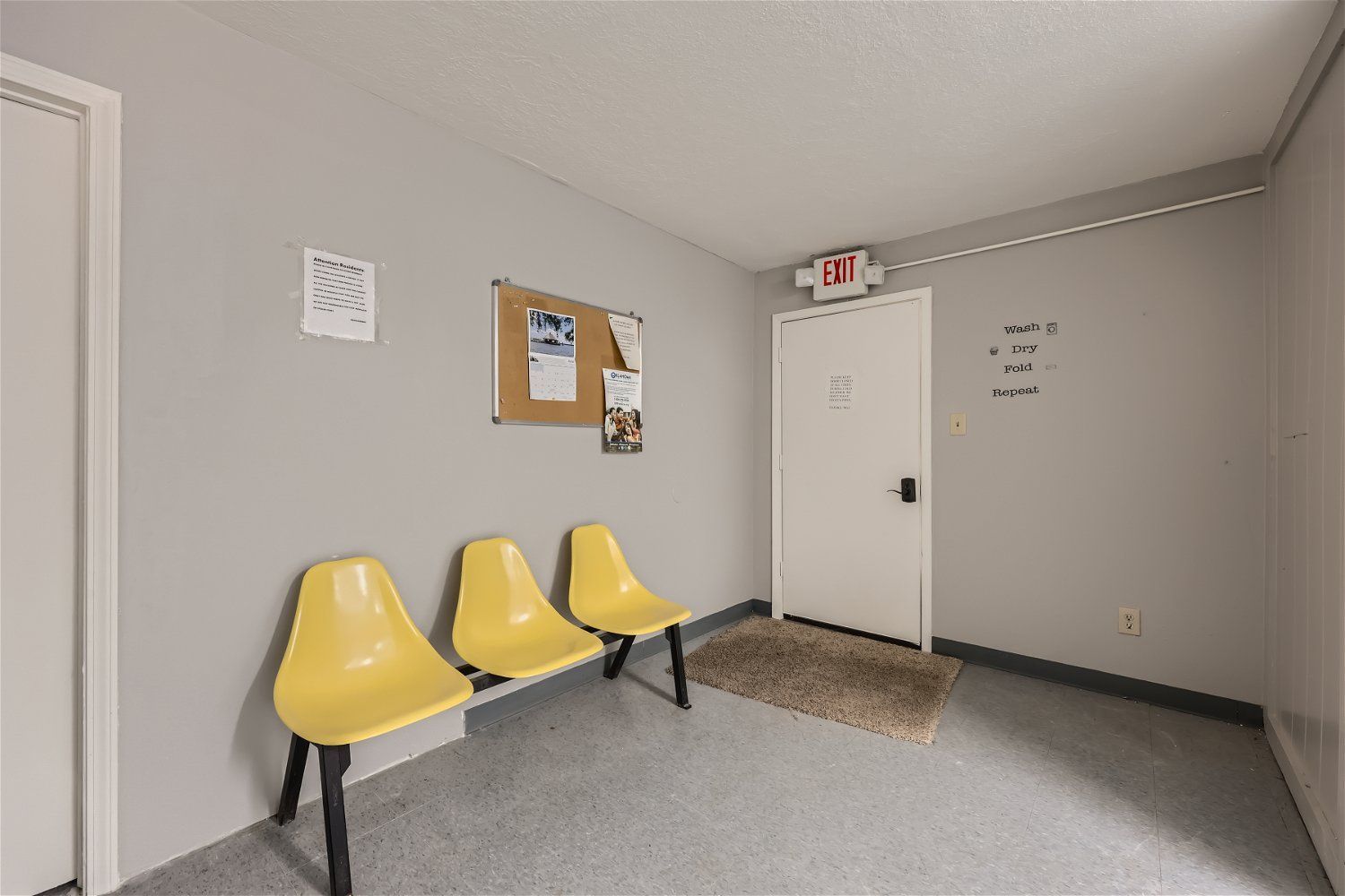 Copperstone Point has a seating area with chairs, bulletin board, and exit door.
