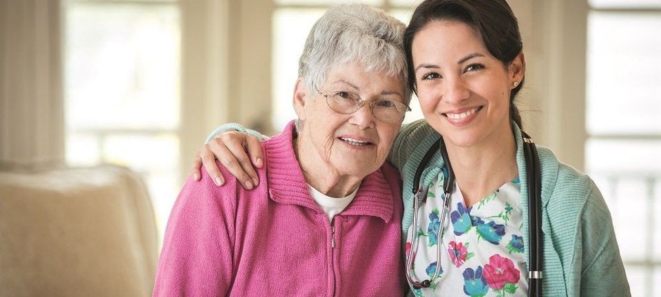 A female nurse and a resident. A female nurse and a resident.