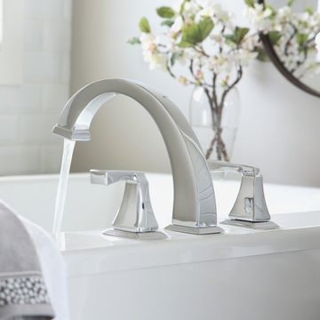 bathroom sink tap with flowing water