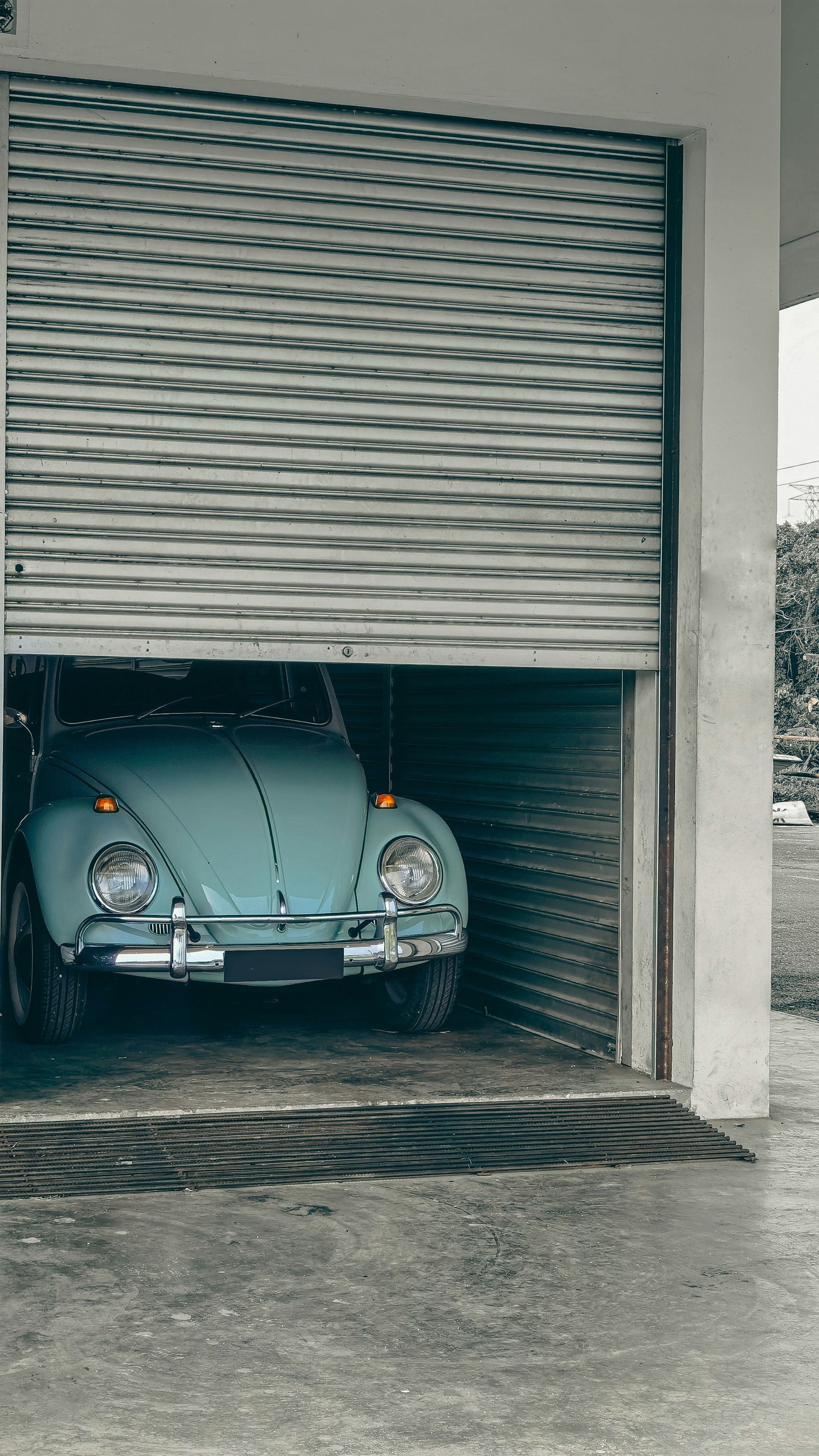 Concrete garage floor with volkwagon bug in calgary